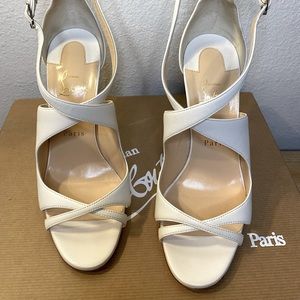 White Christian Louboutin 100 gently used, 8.5